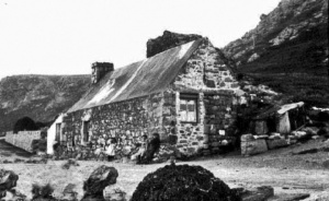 A closer view of the same, typical Jersey, granite cottage - picture believed to be by Albert Smith. The cottage has the datestone 1753 IHB ♥ ELGL for Jean Hubert and Elizabeth Le Gresley