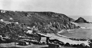 The camp in its early days, with chalets scattered over the headland