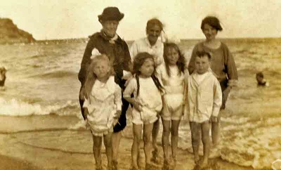 Rimingtons and friends on the beach at Grouville, c1920