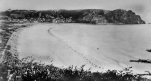 A view of the bay from the west in the 1950s. Numerous chalets can be seen on the headland in the distance