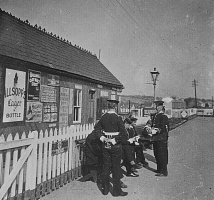 Militiamen waiting for a train at Beaumont Station
