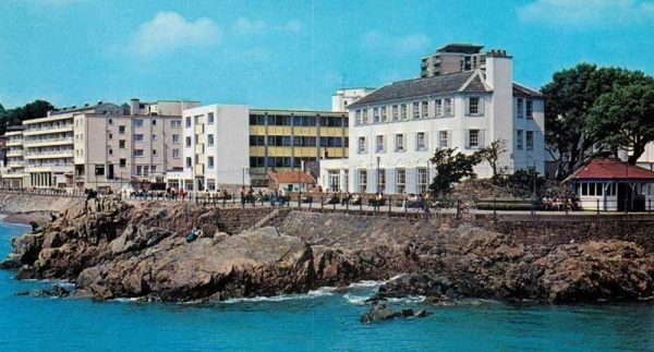 The seafront in the late 20th century, with the Fort d'Auvergne Hotel in the foreground ...