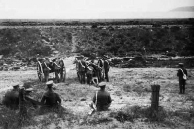 Another view of artillery drill in the hollow behind the seawall. The railway track was then running in the foreground, behind the backs of the seated militiamen
