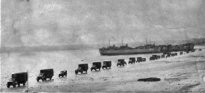 Army vehicles cross St Aubin's Bay