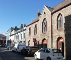 Looking down the street towards the Beresford Street junction we have Church Hall, one of the few buildings in the town centre still faced with the original granite, rather than the cement render with which Victorian property owners delighted in covering their buildings ...