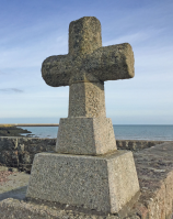 15th century stone cross on the shoreline at St Catherine