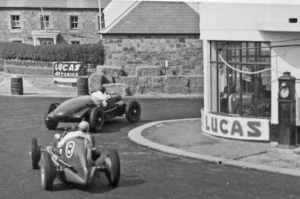 Reg Parnell (Maserati) chases Robert Cowell (Lagonda) through Bel Royal Corner