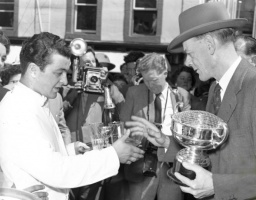 ... 1957 men's winner Antonio Berro of the Woodville Hotel receives his prize from St Helier Constable Fred Clarke