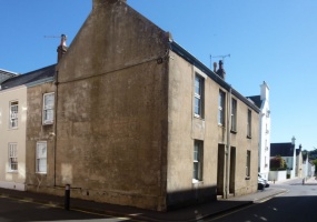 Back to reality, and a strangely attractive, if somewhat neglected, pair of cottages on the street's corner ...