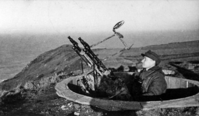 An anti-aircraft gun on the clifftop above Bouley Bay