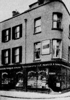 Le Monnier's grocery and wine and spirit merchants on the corner of Pitt Street and Charing Cross in 1895