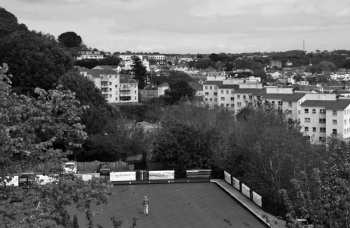 Later: the bowling green, with trees screening the quarry below