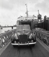 The Queen's Rolls Royce arrives at the harbour in advance of the visit