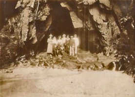 A group of early French holidaymakers pose for a photograph in the cave