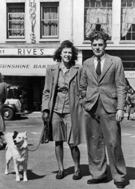 A couple and their dog pose for a commercial photographer at Snowhill