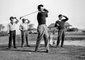 Max Bygraves playing golf during a 1956 visit