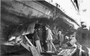 Examining the damage to the hull