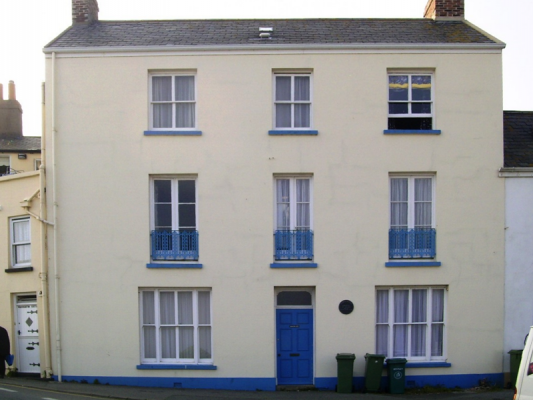 In the 21st century the balcony has gone to be replaced by individual railings outside first floor windows. Otherwise the house is unchanged
