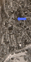 Aerial view of the Green Street area, with an arrow pointing to the field on which the car park was built