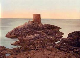 The old coastal tower is on a rock cut off from the point at high tide