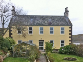 The two-storey western front face of the main house