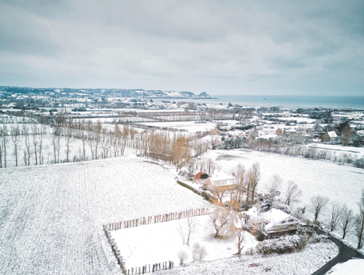 Grouville under snow on 9 January 2024, photographed from his drone by Paul Lakeman.