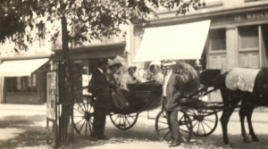 A carriage parked in the square in 1910
