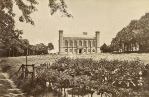 An early photograph showing a pond at the bottom of the grounds and a rough track leading up on the left