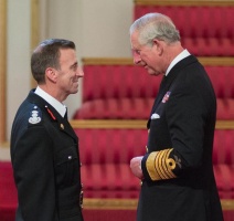 Fire Officer Mark James at a Buckingham Palace investiture with Prince Charles