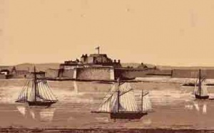 Sailing vessels pass the castle after leaving St Helier Harbour