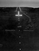 The landing lights viewed from an aircraft approaching the Airport from the east